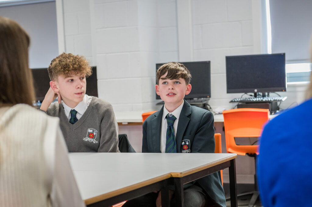 Two secondary school pupils in conversation